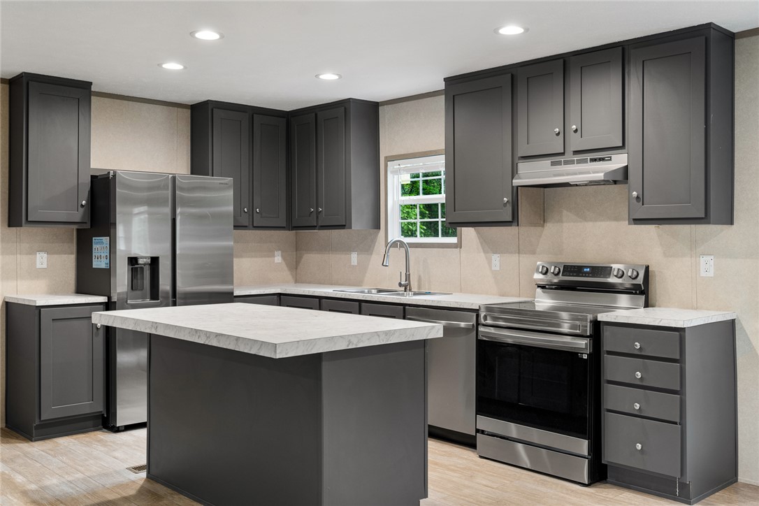419 Austin Drive Anderson, SC 29624 - Photo 15 of 36 This sleek kitchen features stainless steel appliances and ample counter space for culinary endeavors.