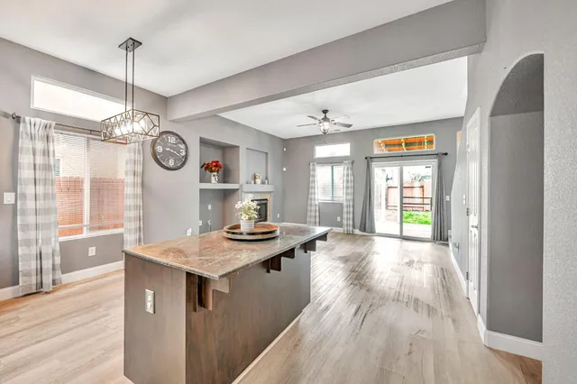 a large kitchen with a wooden floor