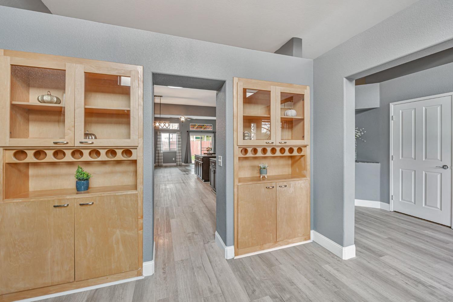 9065 Robbins Road Sacramento, CA 95829 - Photo 15 of 45 an empty room with wooden floor and windows