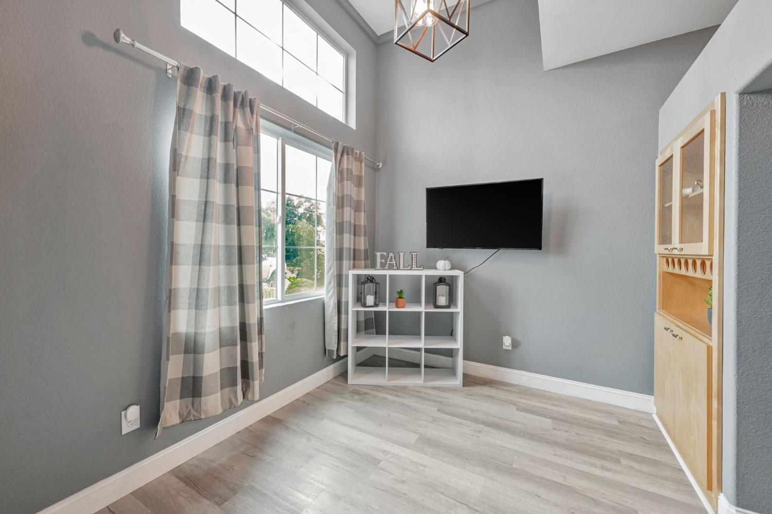 9065 Robbins Road Sacramento, CA 95829 - Photo 16 of 45 a view of a livingroom with wooden floor and furniture