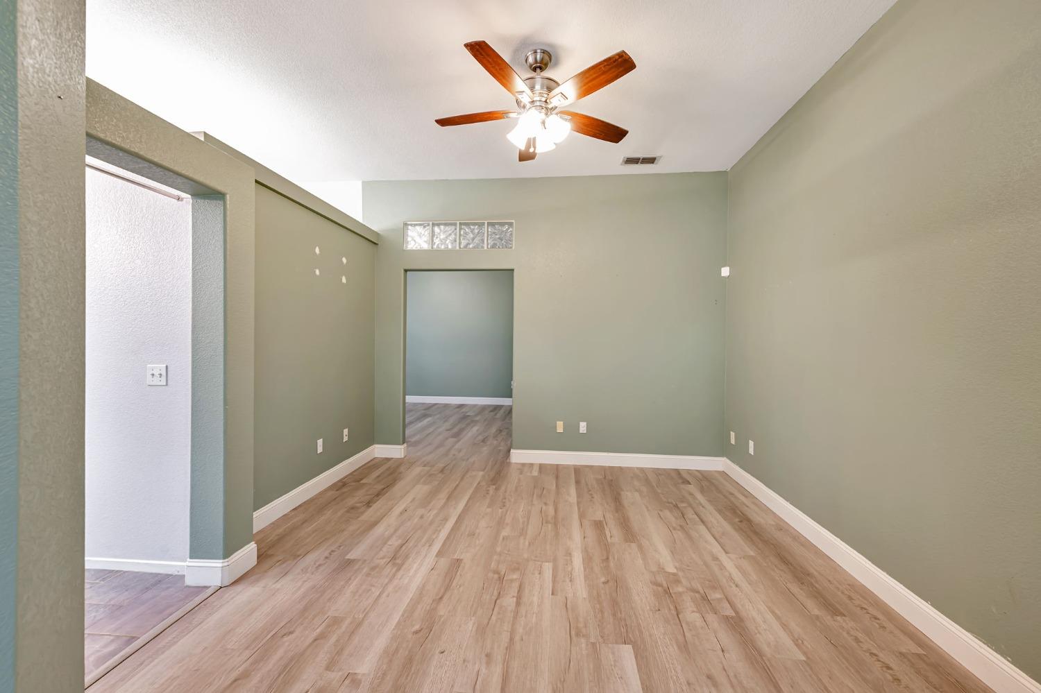 9065 Robbins Road Sacramento, CA 95829 - Photo 18 of 45 a view of empty room with wooden floor