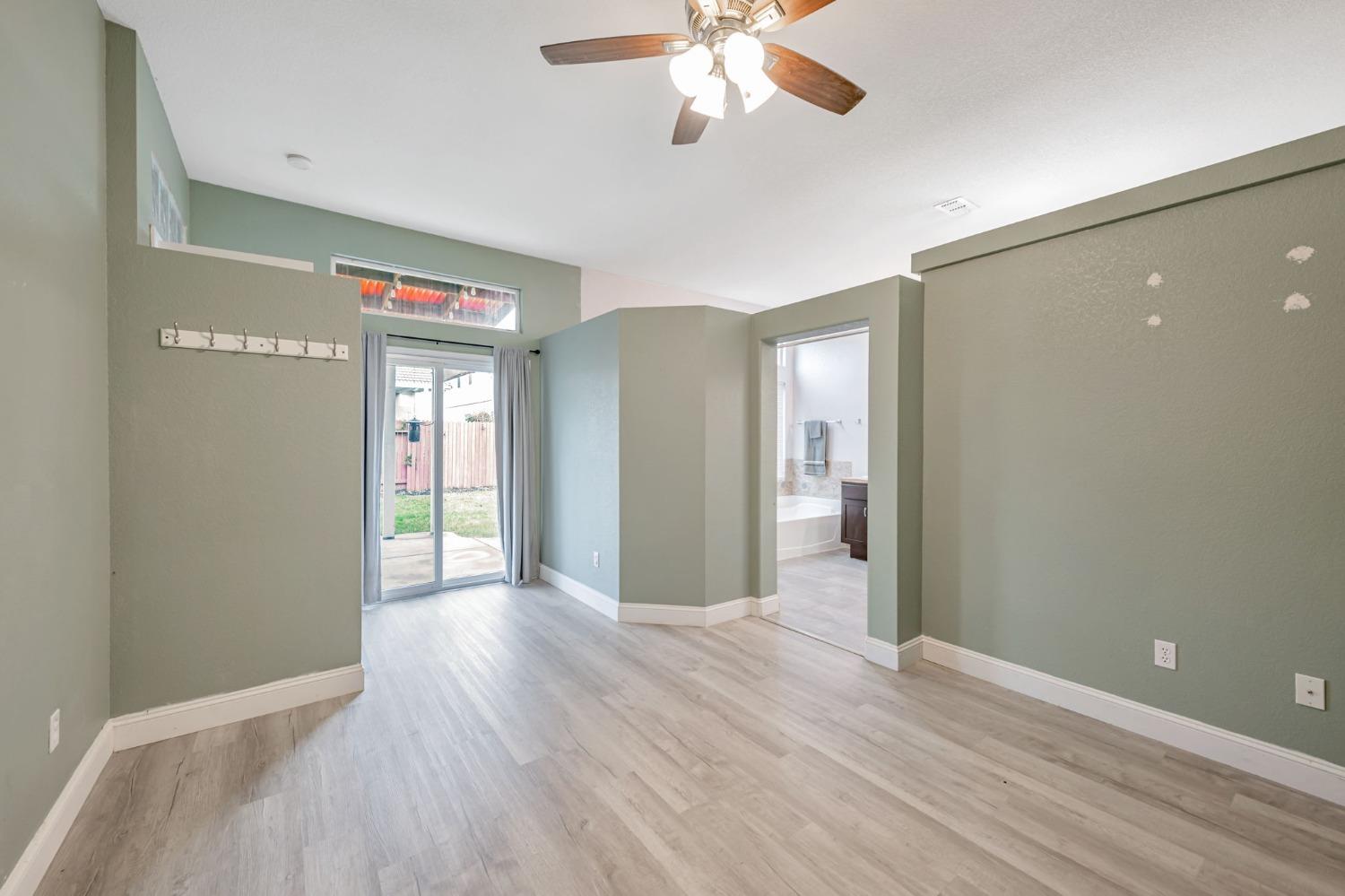 9065 Robbins Road Sacramento, CA 95829 - Photo 19 of 45 a view of livingroom with hardwood floor and ceiling fan