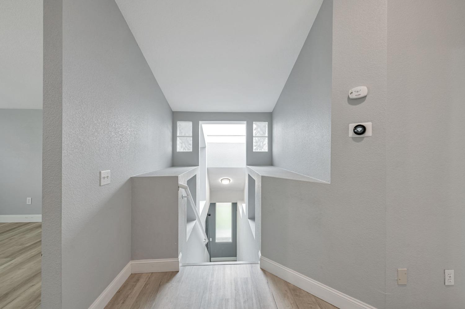 9065 Robbins Road Sacramento, CA 95829 - Photo 25 of 45 a view of hallway with wooden floor