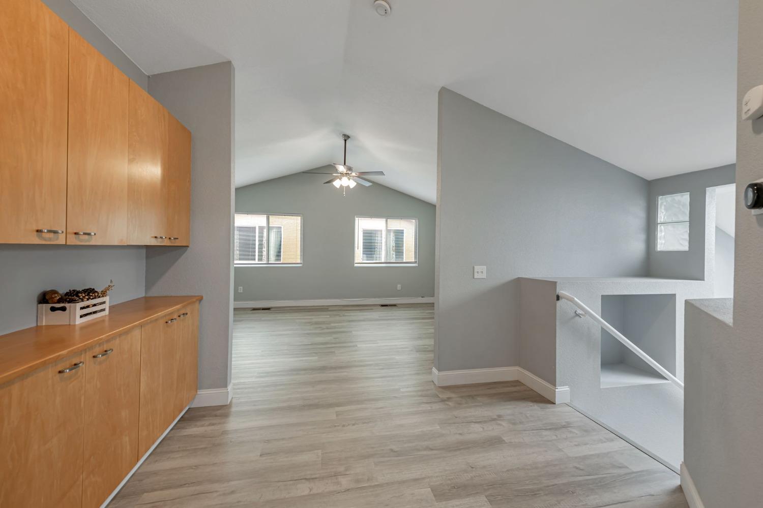 9065 Robbins Road Sacramento, CA 95829 - Photo 26 of 45 a view of a kitchen with wooden floor and electronic appliances