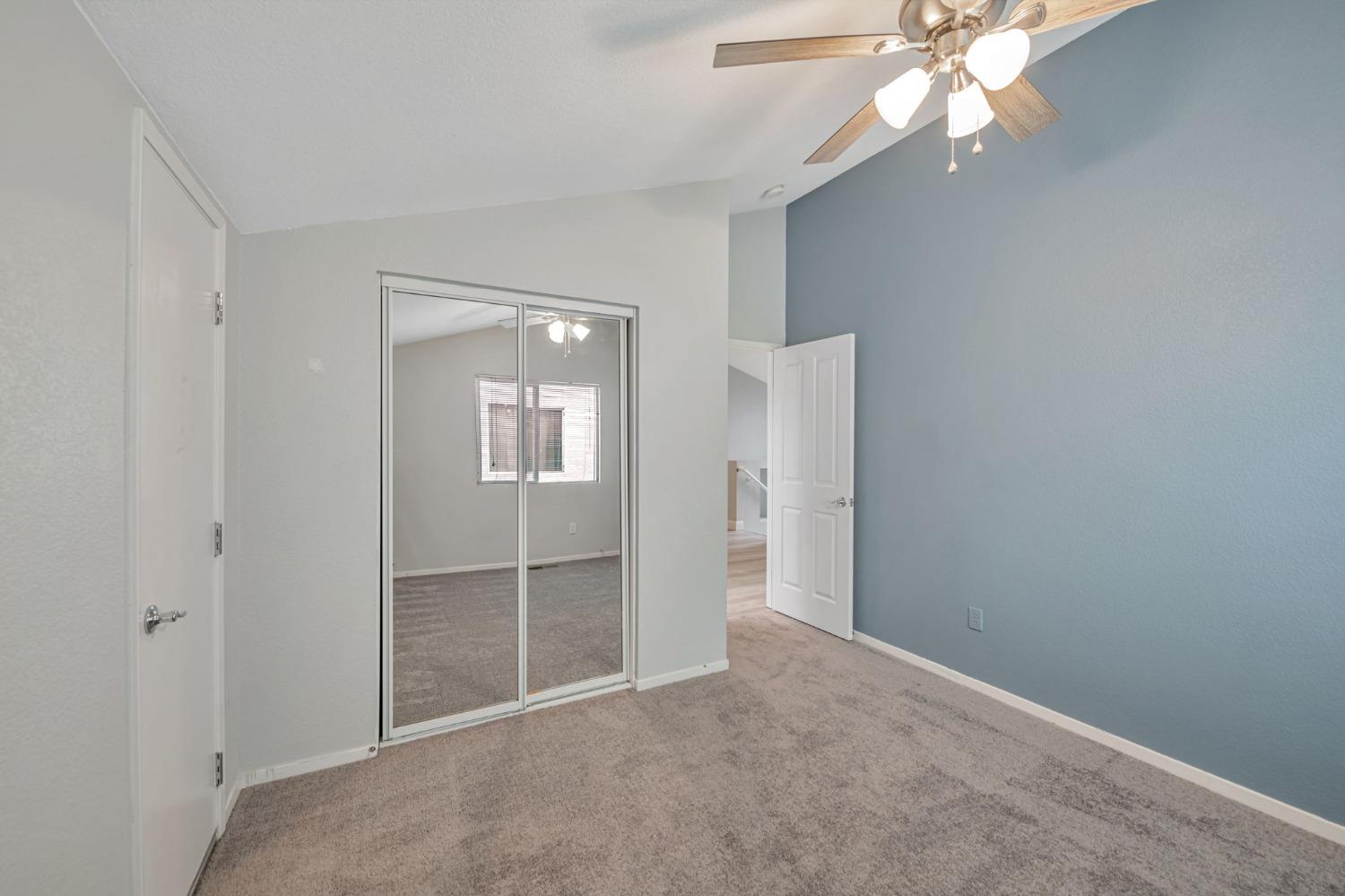 9065 Robbins Road Sacramento, CA 95829 - Photo 36 of 45 an empty room with windows and fan