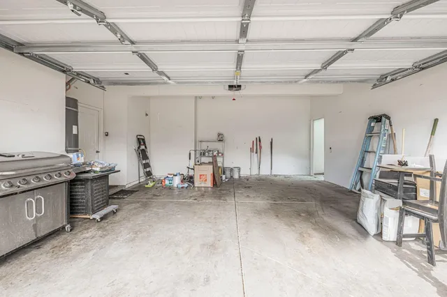 a view of a house with backyard and a patio