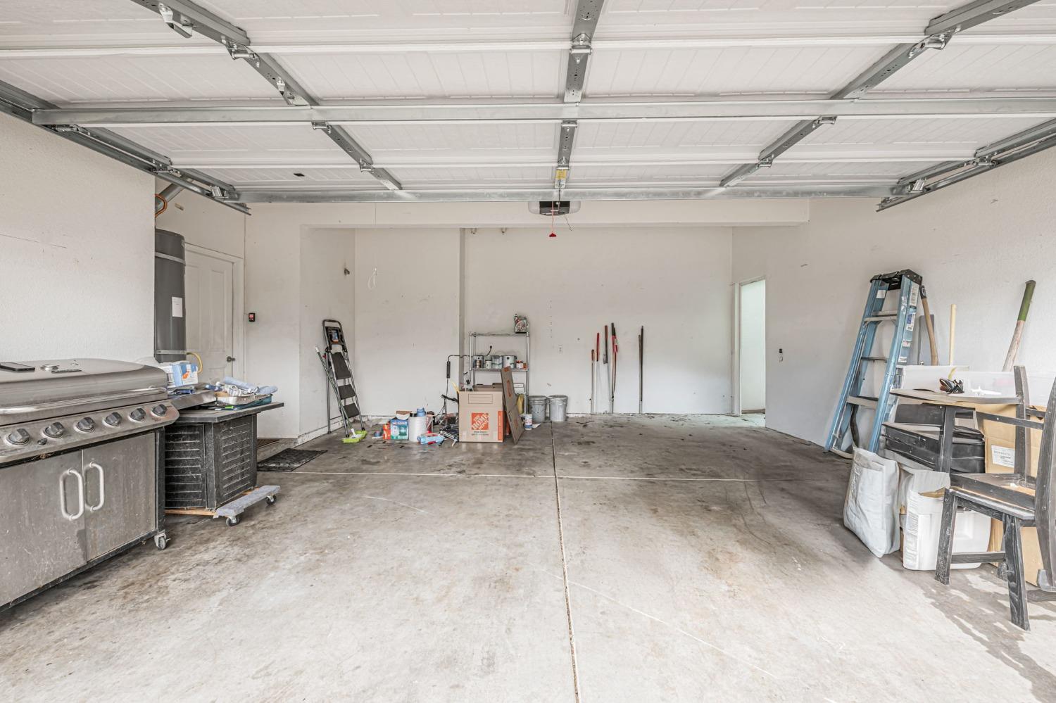 9065 Robbins Road Sacramento, CA 95829 - Photo 40 of 45 a kitchen with stainless steel appliances granite countertop a stove and a refrigerator