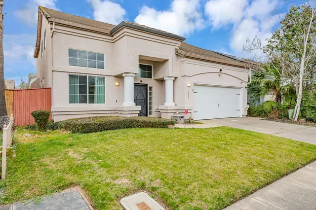 a front view of a house with a yard