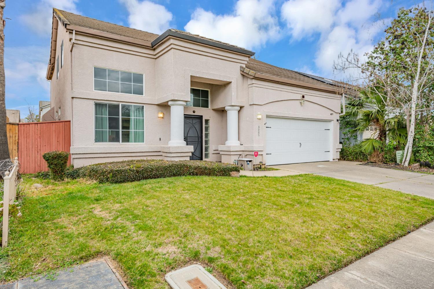 9065 Robbins Road Sacramento, CA 95829 - Photo 4 of 45 a front view of a house with a yard