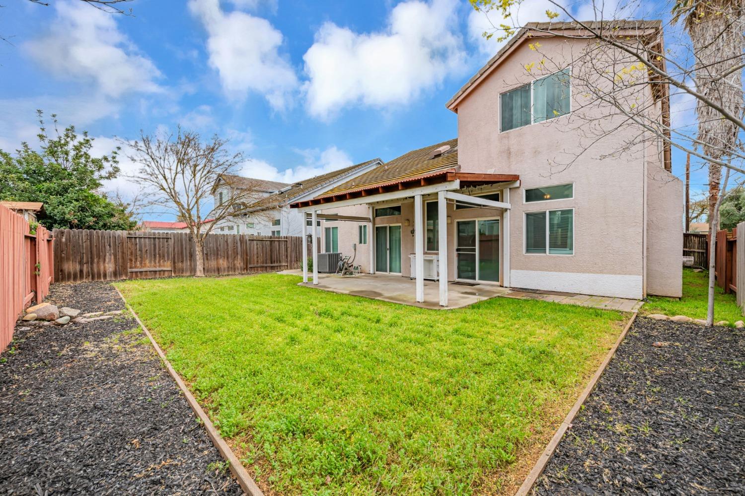 9065 Robbins Road Sacramento, CA 95829 - Photo 42 of 45 a front view of a house with yard