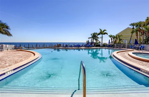 a view of a swimming pool with a lounge chair
