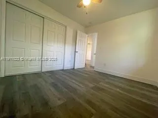 an empty room with a empty space and windows