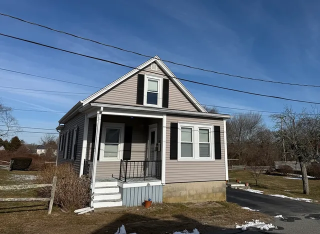 a front view of a house with a garage