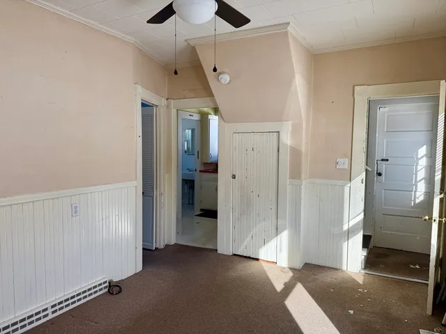 a view of a hallway with a room