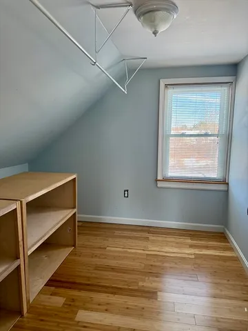 a room with window and a ceiling fan