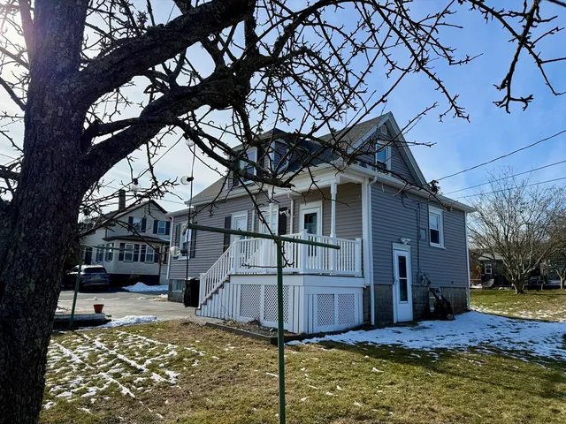 a view of a house with a small yard
