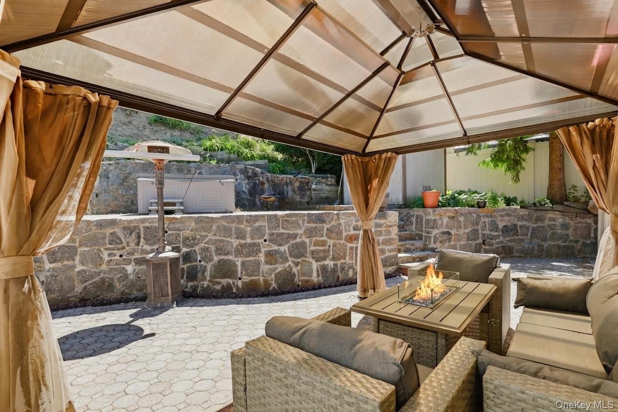 29 Montrose Road Yonkers, NY 10710 - Photo 28 of 39 Covered patio with a translucent roof and stone paver flooring