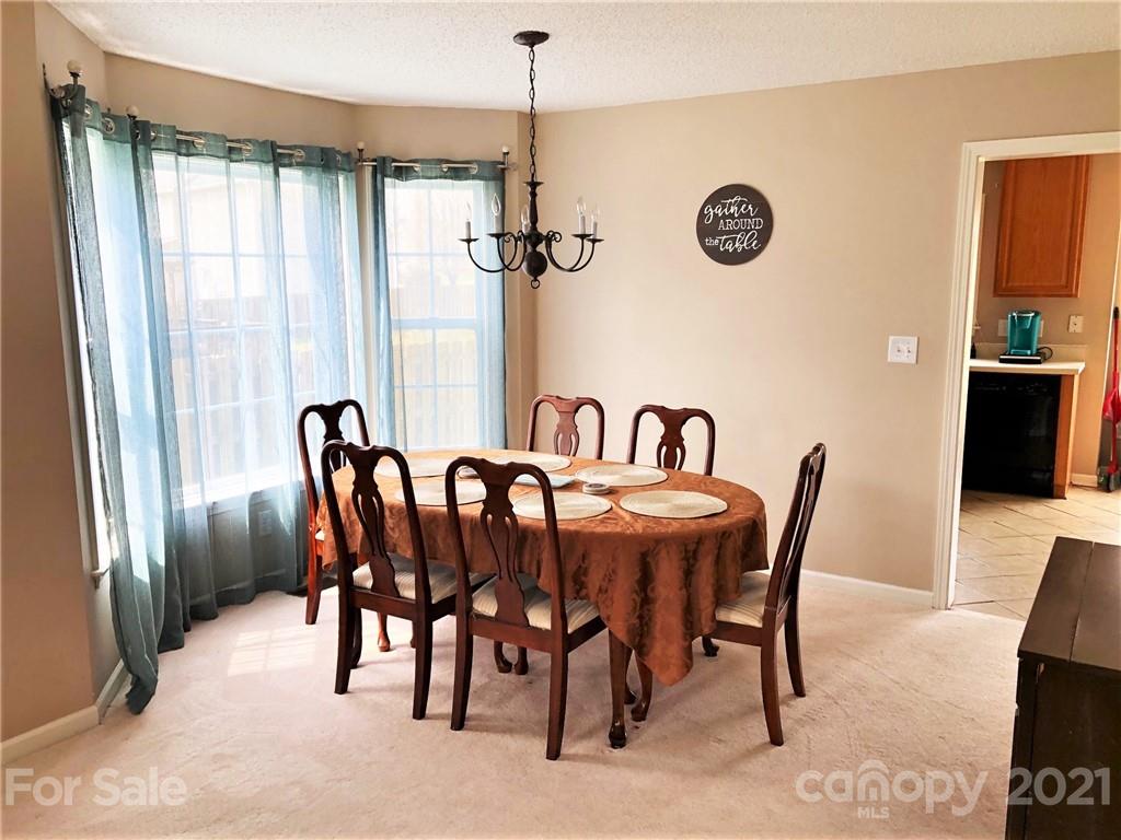 455 English Oak Road Fletcher, NC 28732 - Photo 3 of 6 a view of a dining room with furniture window and outside view