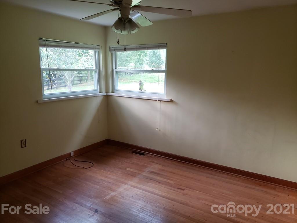 419 Old Michael Road Canton, NC 28716 - Photo 11 of 15 an empty room with a window