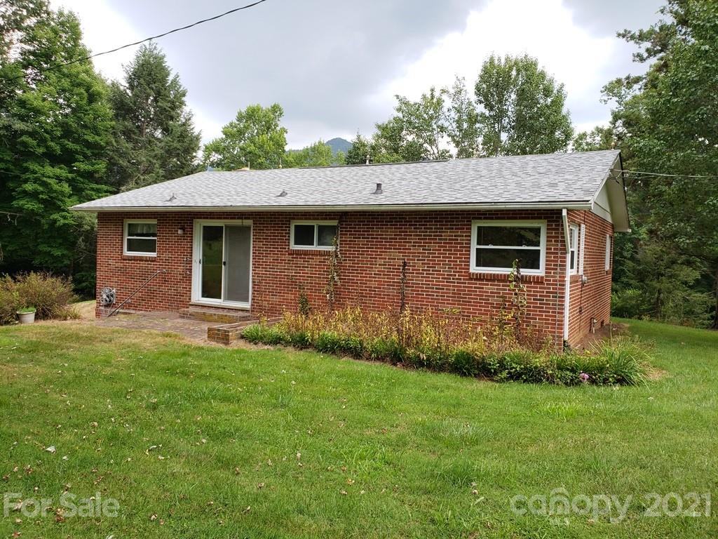 419 Old Michael Road Canton, NC 28716 - Photo 4 of 15 a front view of a house with garden