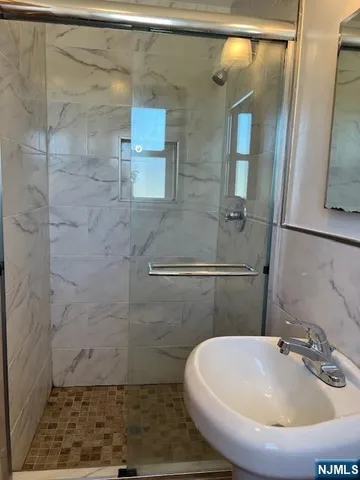 a bathroom with a sink and a shower