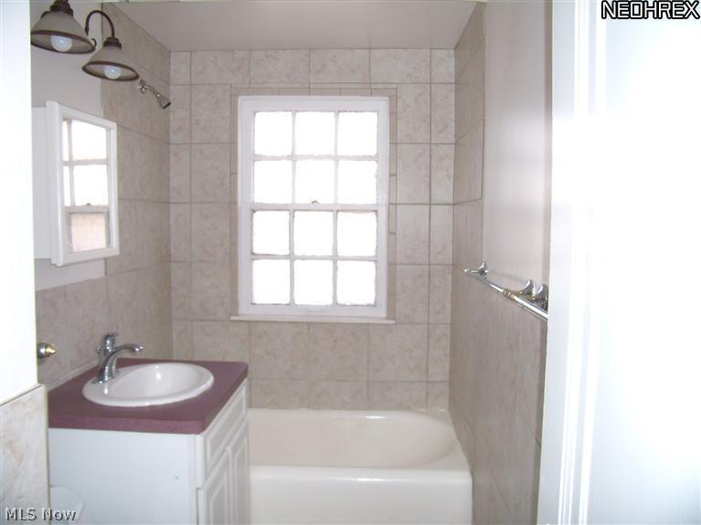 16711 Kenyon Road, Unit DOWN Cleveland, OH 44120 - Photo 11 of 11 The tiled batherrom.