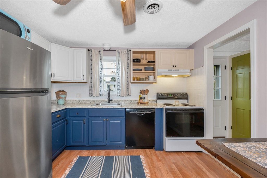43 Constitution Way, Unit 43 Methuen, MA 01844 - Photo 8 of 25 a kitchen with stainless steel appliances granite countertop a refrigerator and a sink