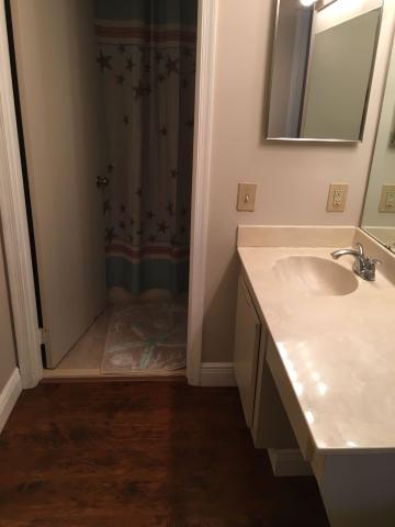 7660 Courtyard Run West Boca Raton, FL 33433 - Photo 7 of 11 a bathroom with a sink and a mirror