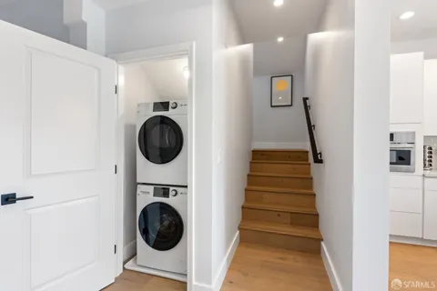 a view of a hallway with washer and dryer