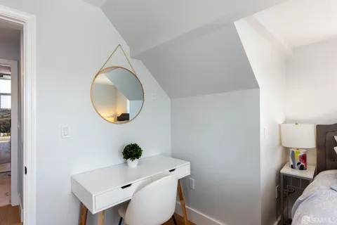 a bathroom with a sink a mirror and vanity