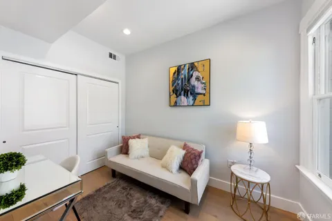 a living room with furniture and a lamp