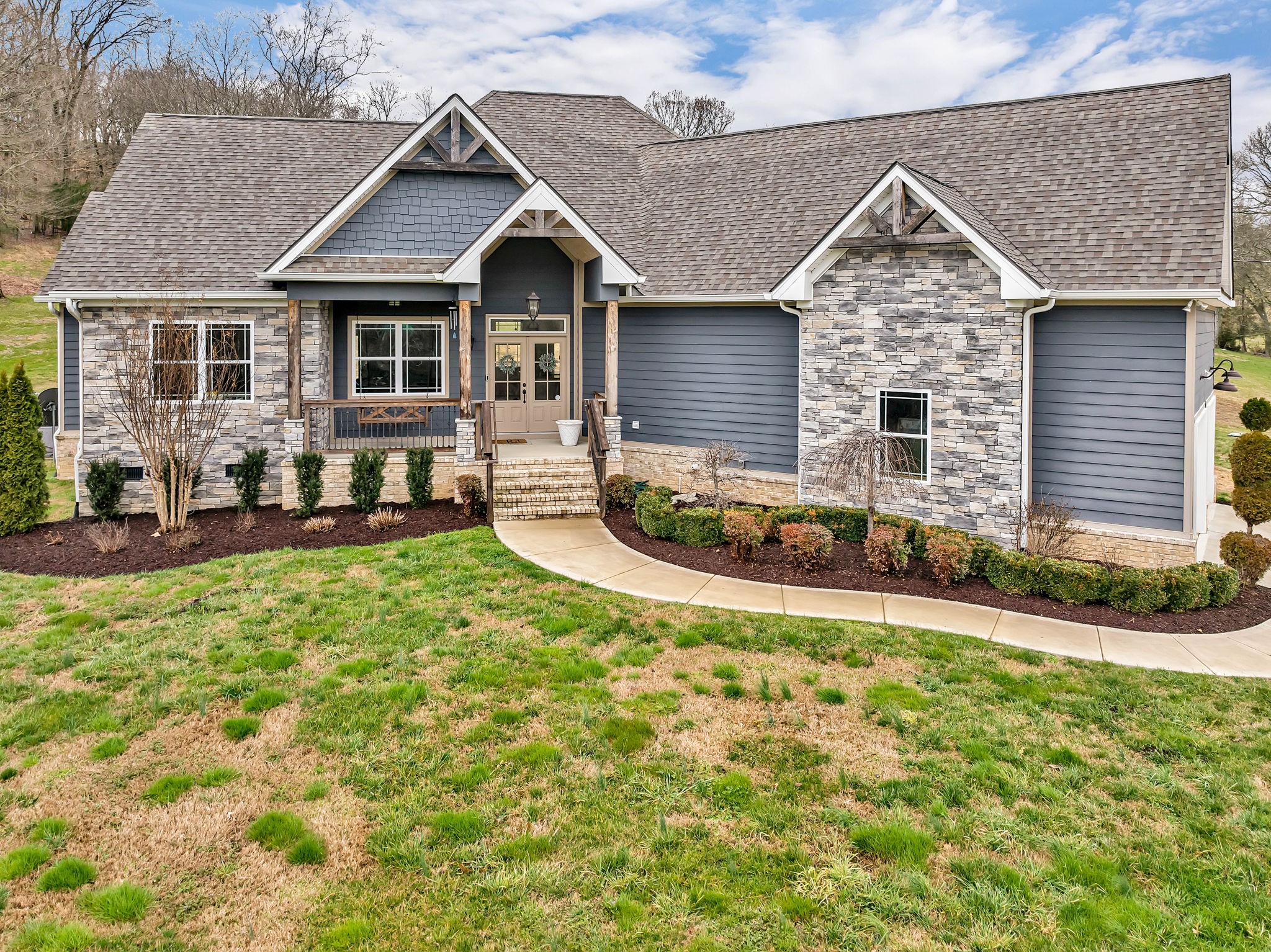 1349 Cliff Amos Road Spring Hill, TN 37174 - Photo 1 of 48 a front view of a house with a yard outdoor seating and garage