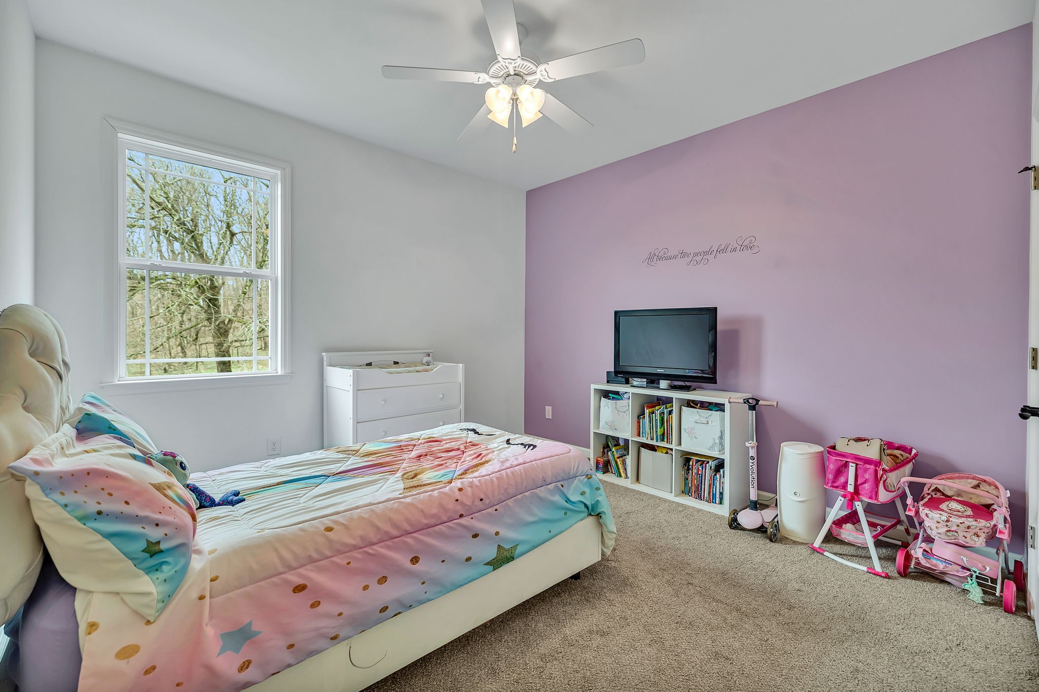 1349 Cliff Amos Road Spring Hill, TN 37174 - Photo 19 of 48 a bedroom with a bed and a flat screen tv