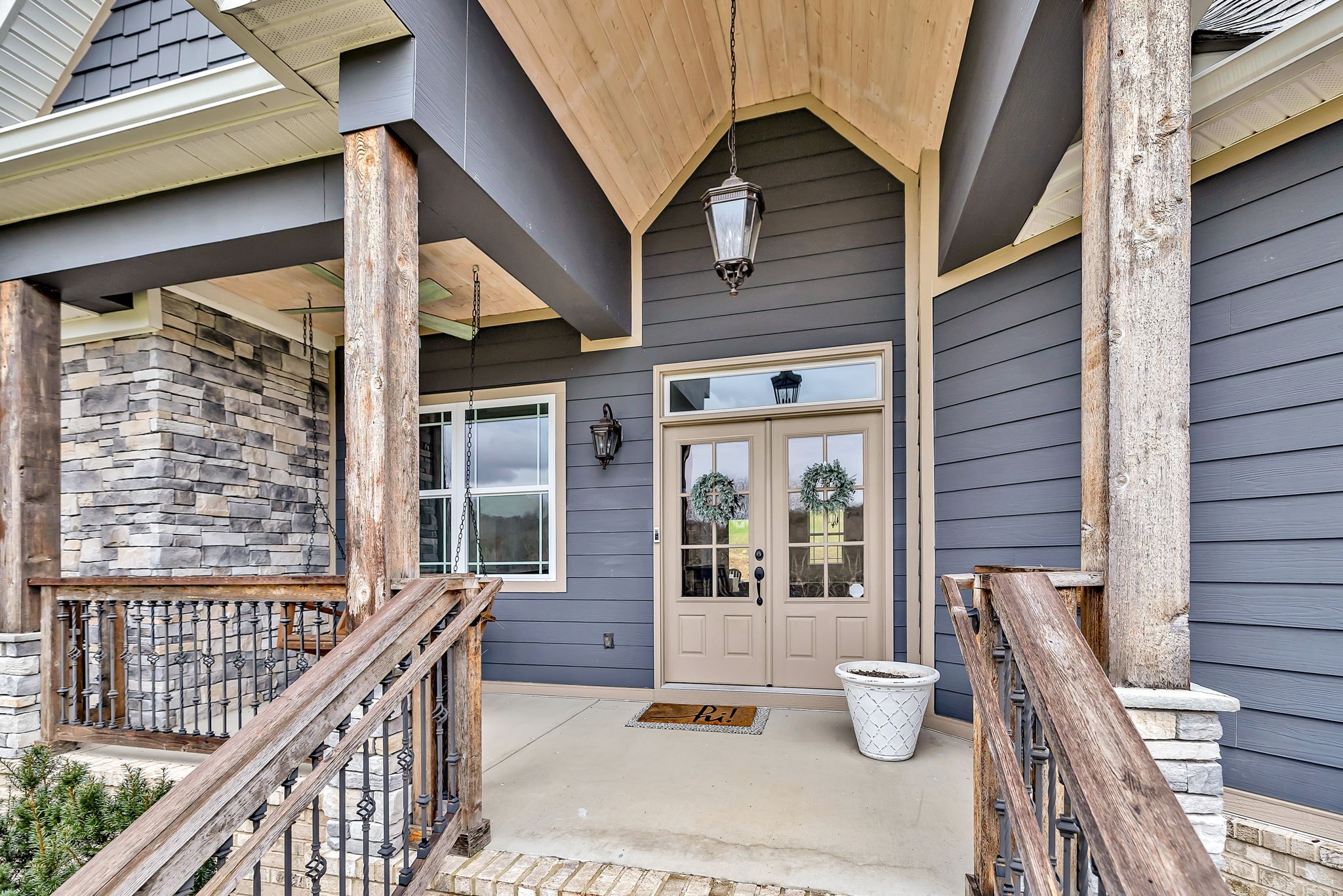 1349 Cliff Amos Road Spring Hill, TN 37174 - Photo 3 of 48 a view of a patio with couches table and chairs and potted plants