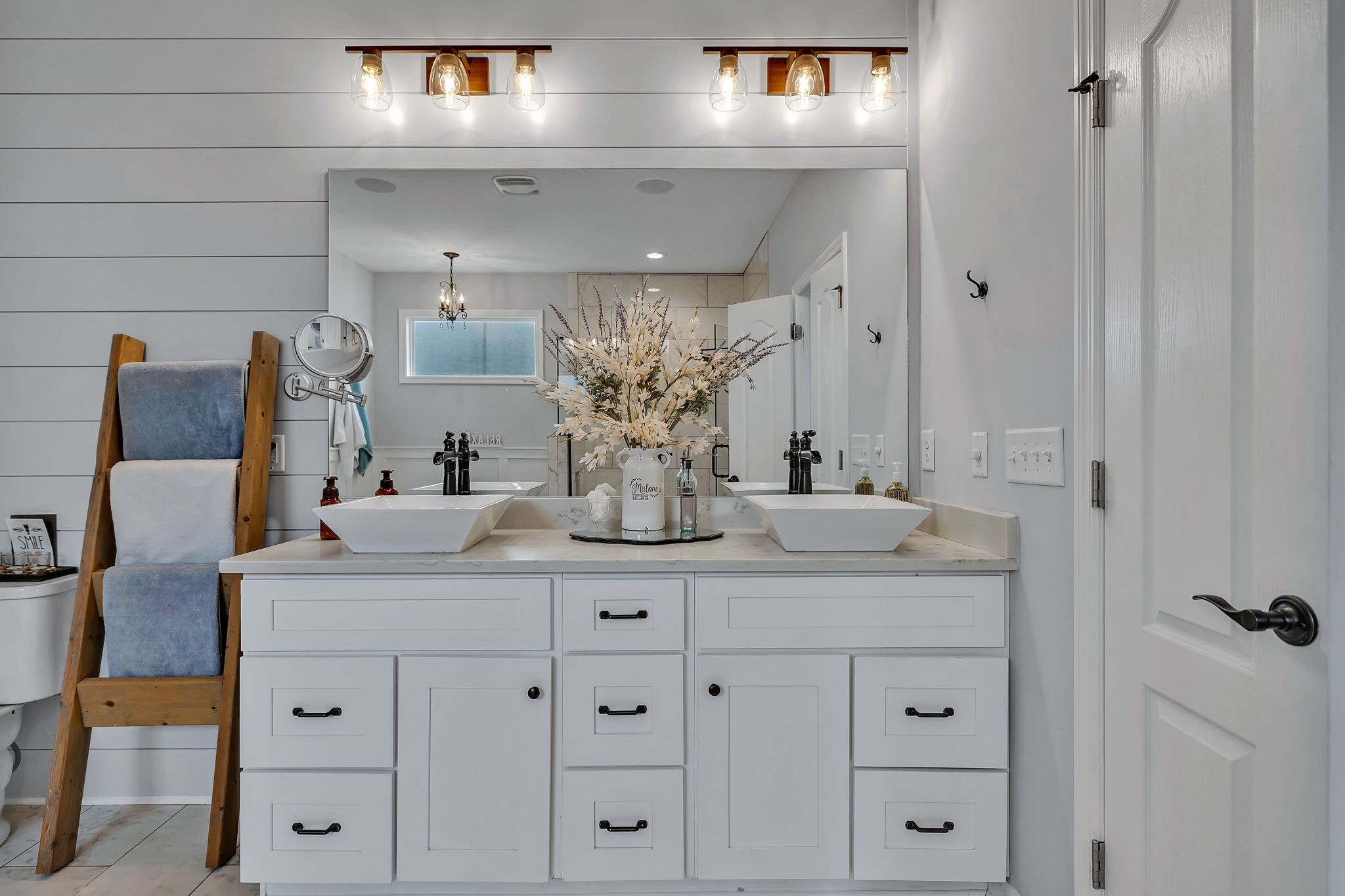 1349 Cliff Amos Road Spring Hill, TN 37174 - Photo 31 of 48 a bathroom with a double vanity sink and mirror