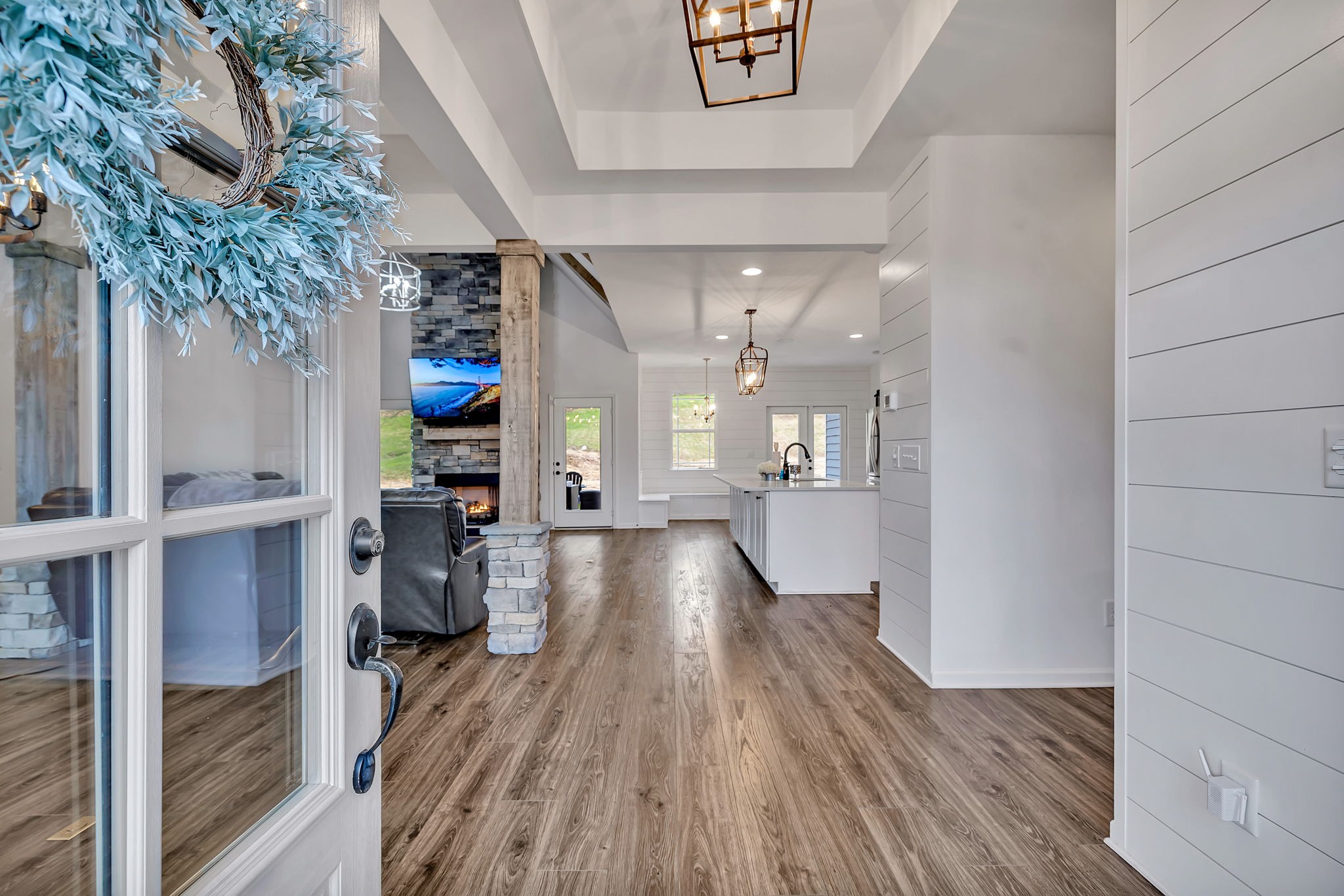 1349 Cliff Amos Road Spring Hill, TN 37174 - Photo 5 of 48 a view of a living room and chandelier with wooden floor