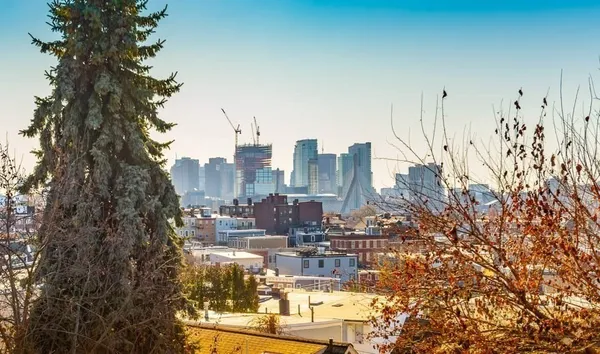 a view of a city with tall buildings