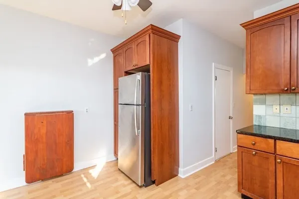 a view of a kitchen from the hallway
