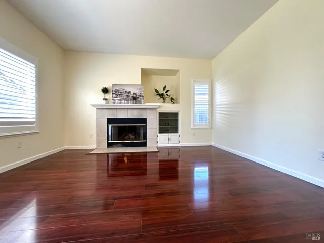 a living room with furniture fireplace and flat screen tv