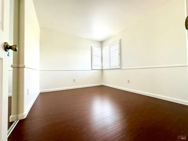 a spacious bathroom with a granite countertop sink mirror and toilet