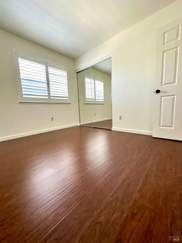 a view of a porch with wooden floor