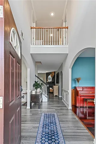 a view of a patio with table and chairs and wooden floor