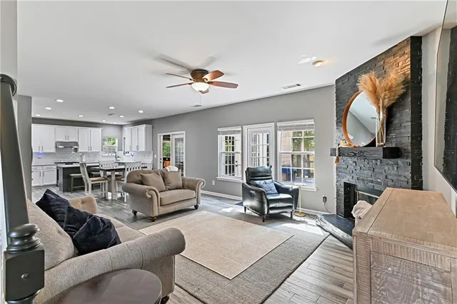 a bathroom with a granite countertop sink mirror and shower