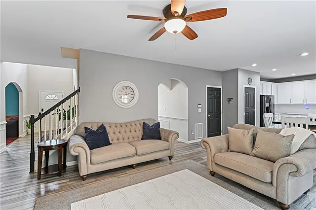 a bedroom with a large bed and a large window