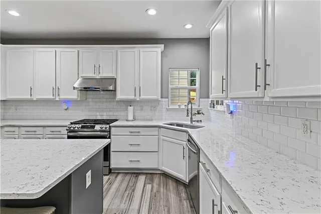 a living room with fireplace furniture and a flat screen tv