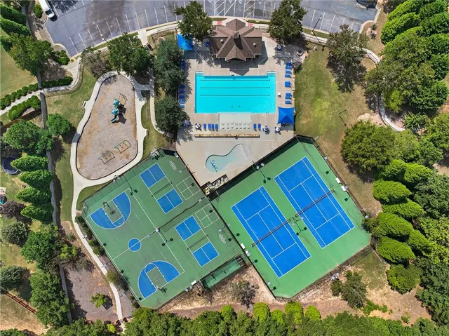 a living room with furniture and a view of kitchen