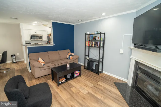 a bedroom with furniture and a flat screen tv