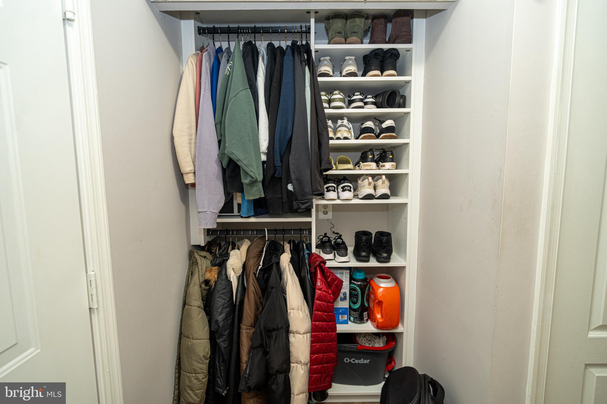 8911 Town Center Circle, Unit 4102 Upper Marlboro, MD 20774 - Photo 5 of 16 a view of walk in closet with clothes and shoes