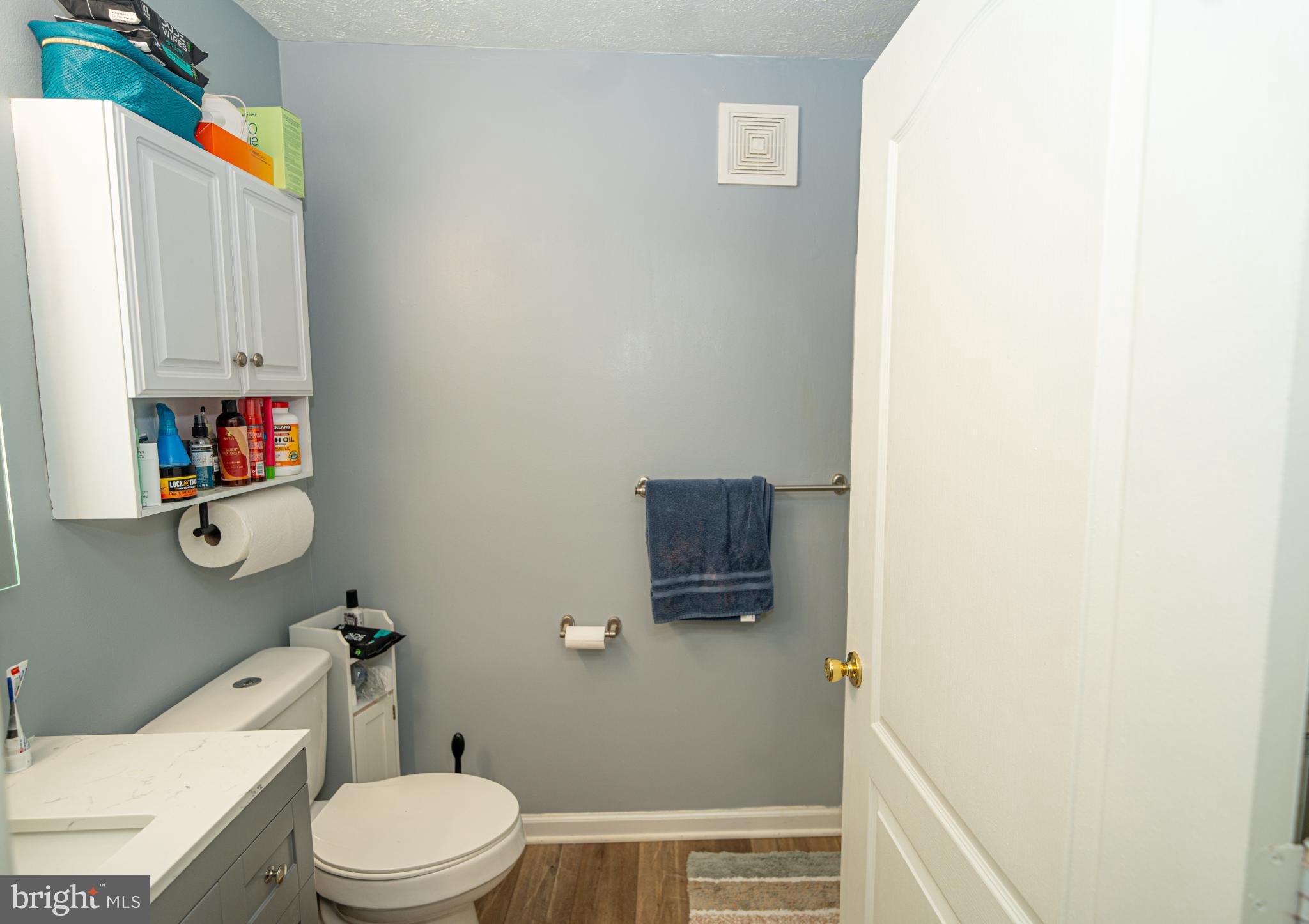 8911 Town Center Circle, Unit 4102 Upper Marlboro, MD 20774 - Photo 7 of 16 a bathroom with a toilet and a sink