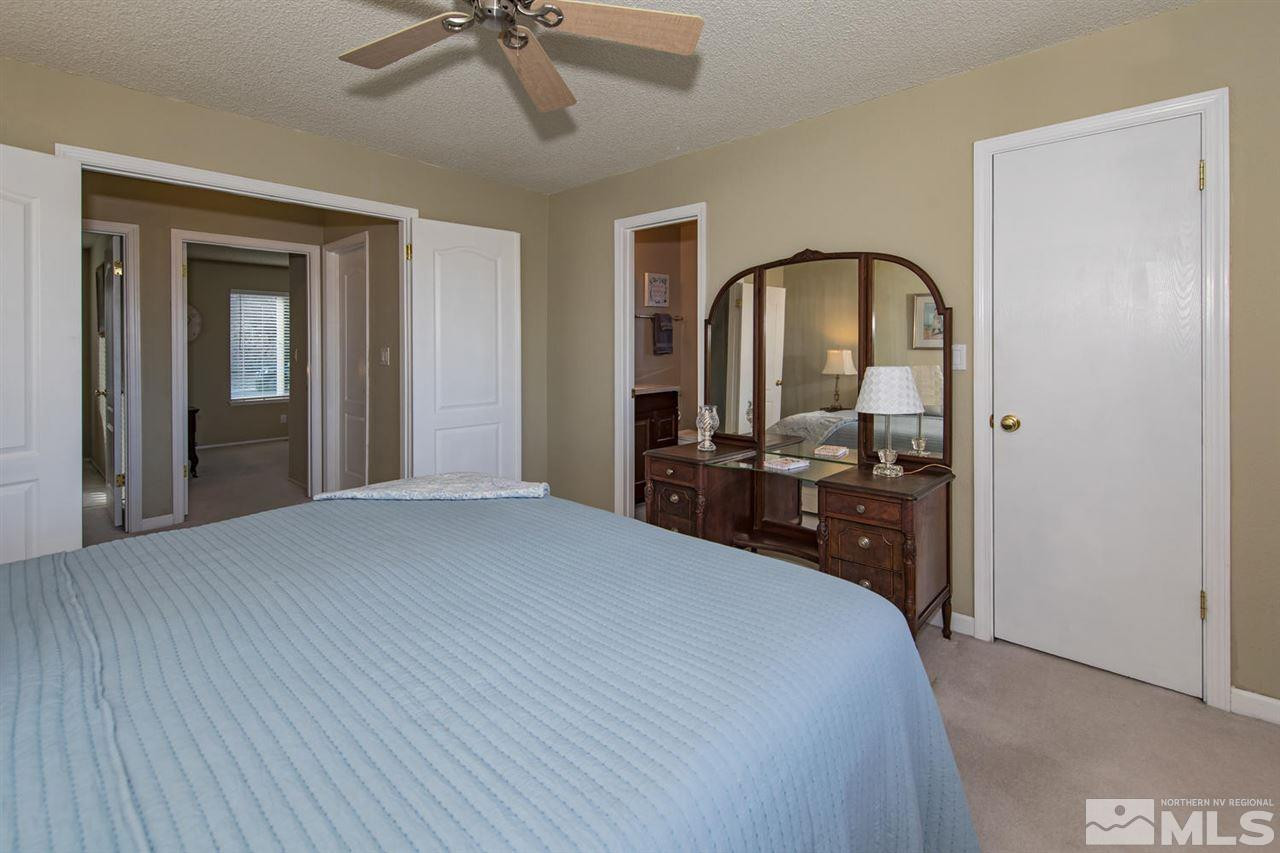 2910 Severn Drive Reno, NV 89503 - Photo 12 of 23 a bedroom with a bed and a dresser
